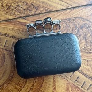 Black knuckles clutch with gems
